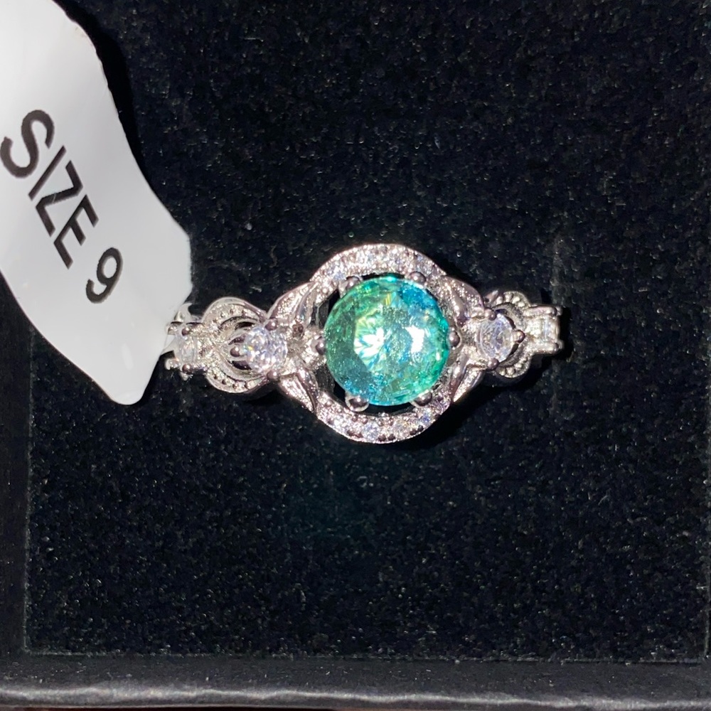 Charmed aroma, sterling, silver ring with a greenish bluish gemstone